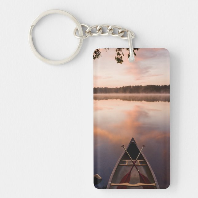 A canoe rests on the shore of Pawtuckaway Lake Keychain (Front)