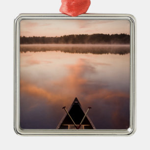 A canoe rests on the shore of Pawtuckaway Lake Metal Ornament