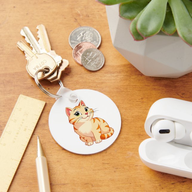 a cartoon orange tabby cat keychain (Desk)