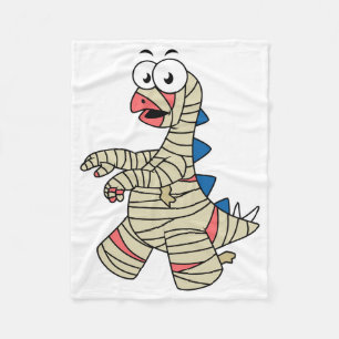 A Cartoon Stegosaurus Dressed Up As A Mummy. Fleece Blanket