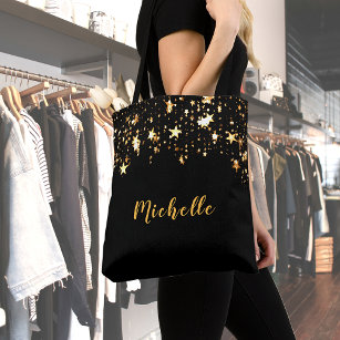 A cascade of golden stars on black add name tote bag