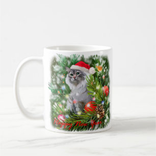 A cat in a Santa Claus hat and a Christmas tree Coffee Mug