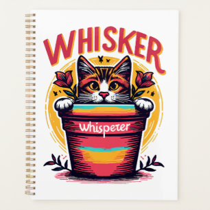 A cat peeking out from behind a flowerpot planner