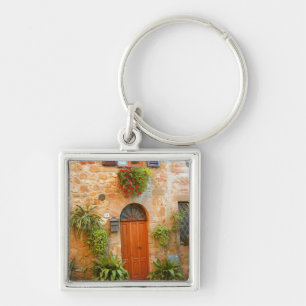 A cat seeks entrance to home in Pienza, Italy. Keychain