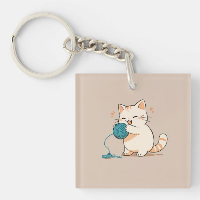 A cat spinning yarn is so cute keychain (Front)