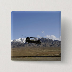 A CH-47 Chinook takes off 2 Inch Square Button