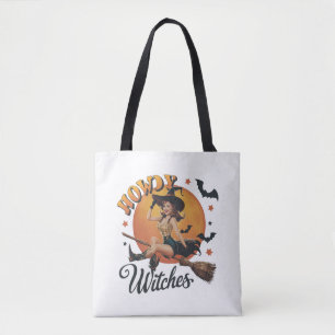A cheerful witch riding a broomstick tote bag