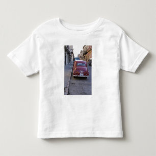 A classic old red Peugeot car parked on a street Toddler T-shirt