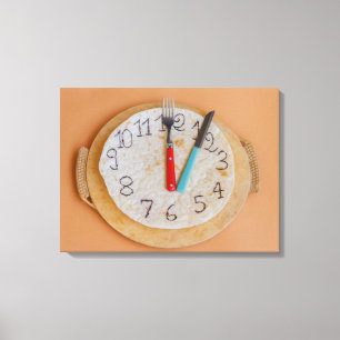 a clock made of piadina wrapped canvas print