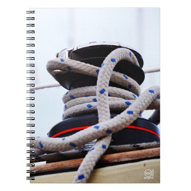 A close-up of a sailboat winch on a boat. notebook (Front)