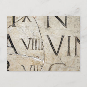 A close-up of ancient Roman letters on marble. Postcard