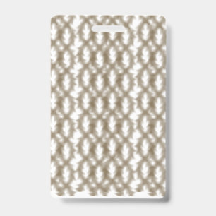 A close-up view of a crisscrossing wire mesh grid badge