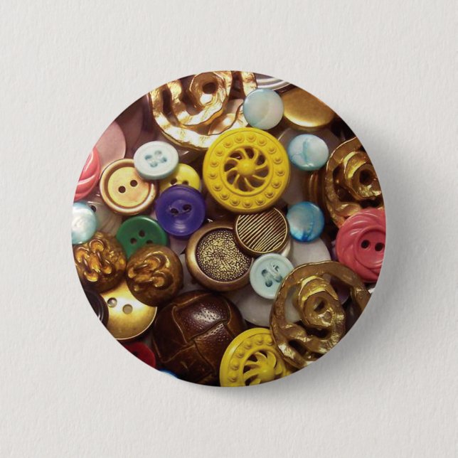 A Collage of Buttons including Yellow Wheel Button (Front)