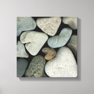 A collage of heart-shaped beach stones canvas print