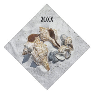 A Collection of Seashells on Sand Graduation Cap Topper