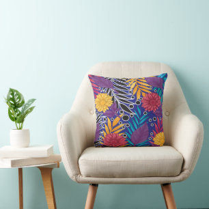 a colourful flower and leaves pattern on a blue ba throw pillow
