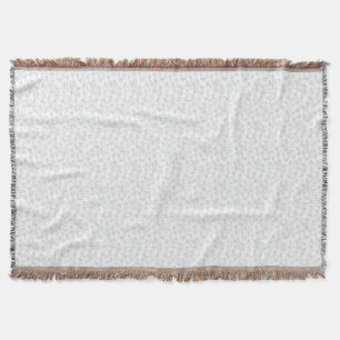 A completely white, featureless surface fills the  throw blanket