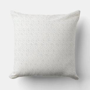 A completely white, featureless surface fills the throw pillow