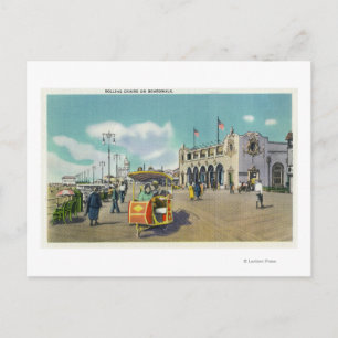 A Couple in a Boardwalk Rolling Chair Scene Postcard