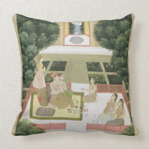 A couple in a garden listening to music with femal throw pillow
