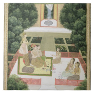 A couple in a garden listening to music with femal tile