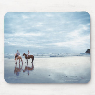 A couple riding horses on Parkiri beach in New Mouse Pad