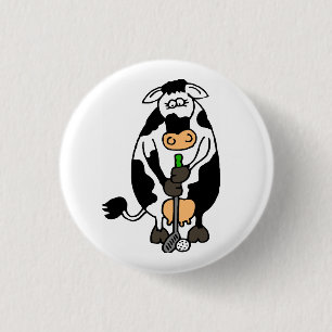 A cow playing golf 1 inch round button