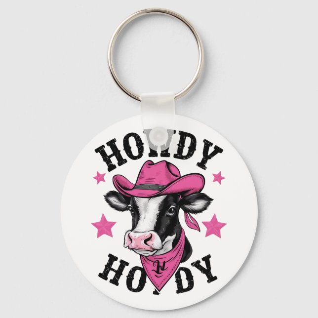 A cow wearing a vibrant pink cowboy keychain (Front)