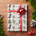 A Cowboy Merry Christmas Wrapping Paper<br><div class="desc">This holiday season put a smile on someone's face with this cowboy themed gift wrapping paper. This playful and unique design includes a full Western theme with colourful illustrations to include cowboy boots,  cactus,  horseshoes,  Christmas trees and candy canes.</div>