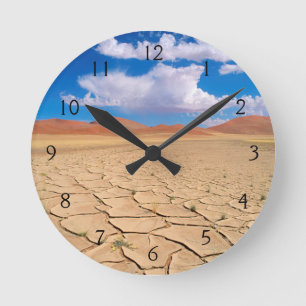 A cracked desert plain round clock