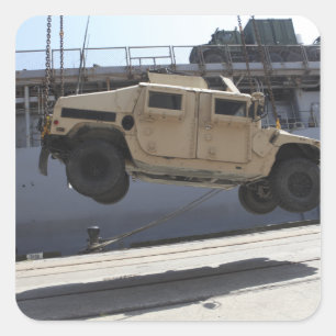 A crane lifts an M998 Humvee Square Sticker