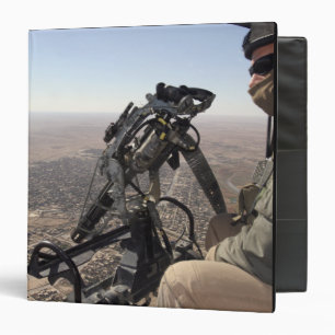 A crew chief looks for suspicious activity binder