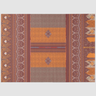 a cross stitch pattern in orange and brown tissue paper