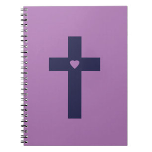 A cross with heart notebook