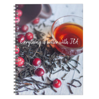 A cup of tea with cranberries notebook