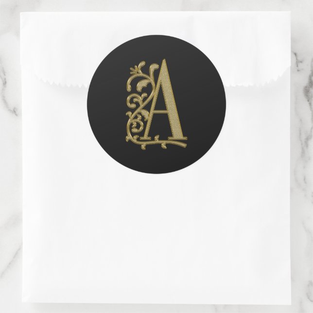 A curly monogram on black classic round sticker (Bag)
