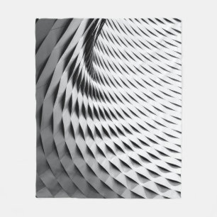 A curved facade covered in white latticework fleece blanket