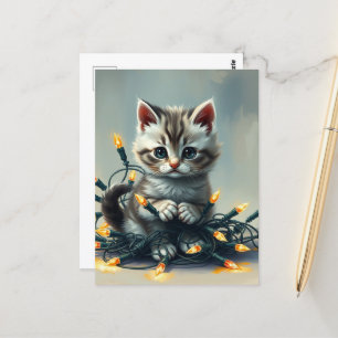 A cute Kitten Wrapped in Christmas Lights Postcard
