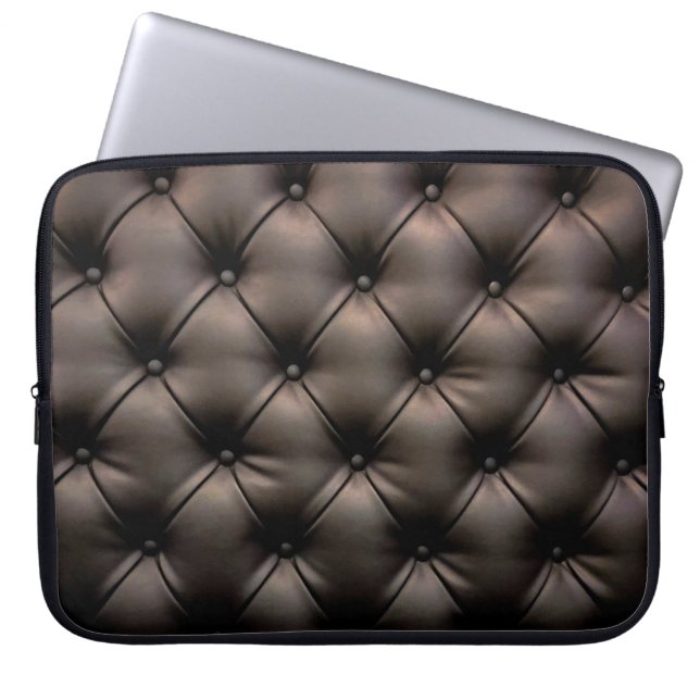A dark leather cushion background, from a car seat laptop sleeve (Front)