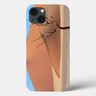 A dead tree on a desert plain with dunes iPhone 13 case