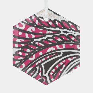 A decorative paisley design with vivid red and pin glass ornament