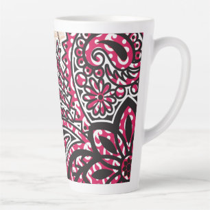 A decorative paisley design with vivid red and pin latte mug