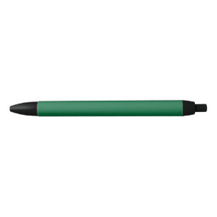 A deep green background contrasted by a crisp whit black ink pen