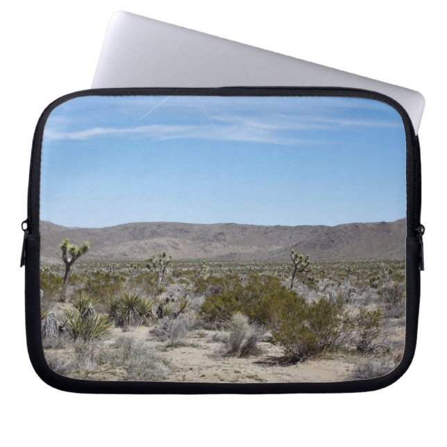 a desert landscape with some cactuses arround on laptop sleeve (Front)