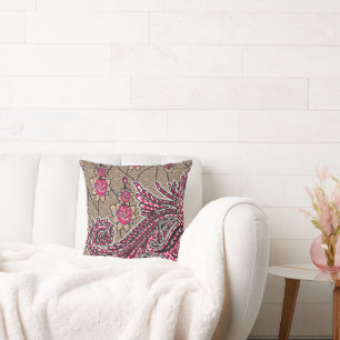 a design of a pink and brown paisley pattern throw pillow