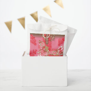 a design of a pink and gold background with a red  favour bag
