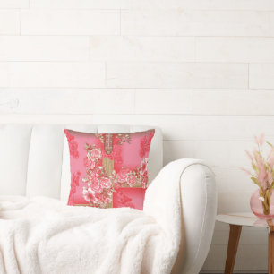 a design of a pink and gold background with a red  throw pillow