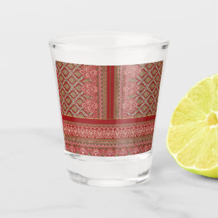 a design of a red and beige pattern_ shot glass