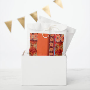 a design of a red and gold pattern favour bag