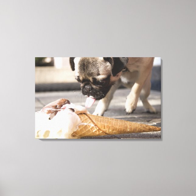 A dog eating an ice cream from a pavement canvas print (Front)